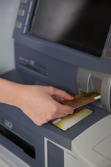 entering card into the ATM