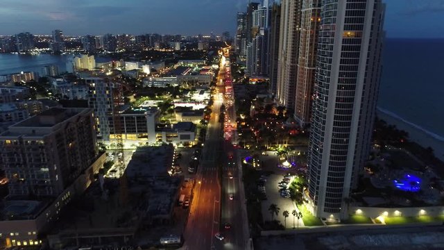Illuminated cityscape of Collins avenue, Sunny Isles, Miami, United States. Illuminated cityscape of Collins avenue, Sunny Isles, Miami, United States. Illuminated cityscape of Collins avenue