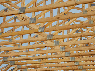 Construction carpentry roof trusses raised center - obrazy, fototapety, plakaty