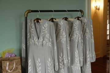 Bridesmaids dresses hanging up on a wedding day