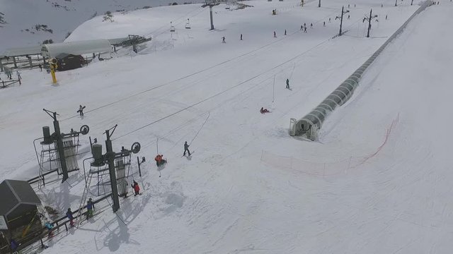 draglift and people skiing in Alto Campoo ski resort aerial shot