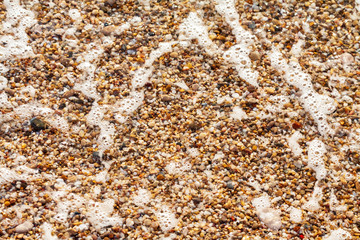 sea pebbles colored granite on the beach