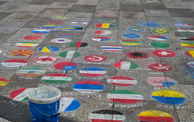 Colorful Chalk Flag Drawings on Stone Pavement in Cologne Germany