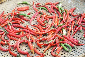 red chili on bamboo basket