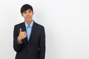 Young handsome asian business man smiling and showing thumbs up isolated on white background.