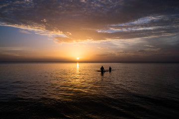 Fototapeta premium boat at sunset on rio beach in amazon.