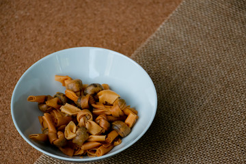 Fototapeta premium Popia Simpul Kasih is a Traditional Malaysian food or snack. Made from crispy fried wheat flour with sweet dry fish inside.