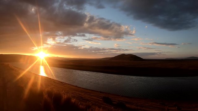 Beautiful sunset colors in the sky at peruvian highlands on an adventure road trip