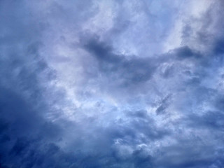 The sky is cloudy, rain is falling. A stratocumulus cloud belongs to a genus-type of clouds characterized by large dark.