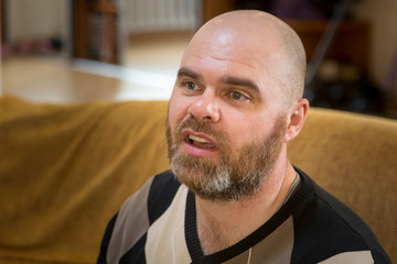 Portrait of a bald man with a beard