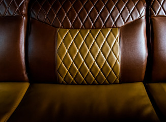 Retro old brown leather sofa texture background.