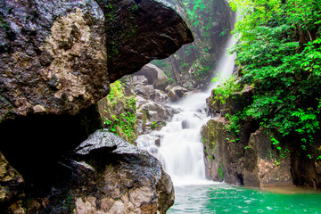 Fototapeta na wymiar Beautiful waterfall in tropical rain forest at Thailand.Namtok Phlio in national park, Chanthaburi Province, Thailand.