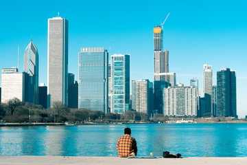 Person sitting on Lake Michigan in Chicago