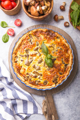 Homemade quiche lorraine with chiken, mushrooms, cheese. top view. Cooking. Spices, butter.  Tart.