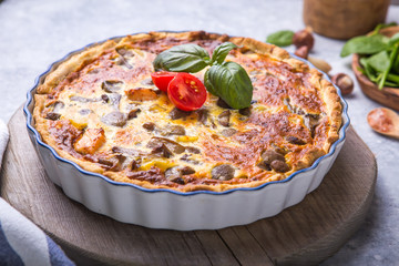 Homemade quiche lorraine with chiken, mushrooms, cheese. top view. Cooking. Spices, butter.  Tart.