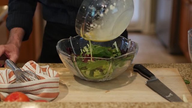 Making salad dressing and tossing salad