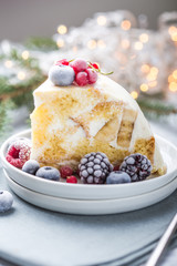 Christmas biscuit cake with cranberries and New year  decorations on a light background.