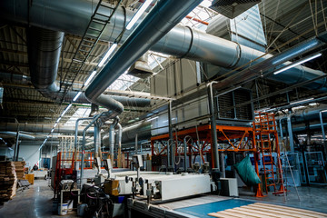 Fototapeta premium Production line of the wooden floor factory. CNC automatic woodworking machine.