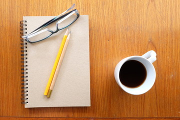 note paper and coffee on wooden table