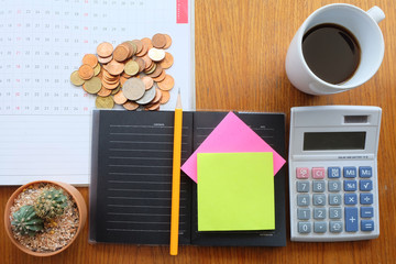 Naklejka premium coin and planner with business concept