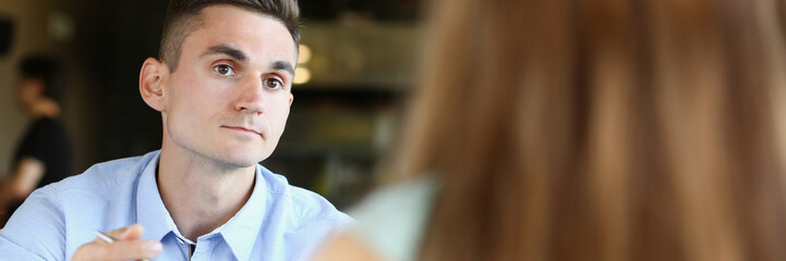 Obraz premium young beautiful man and woman meet in cafe business