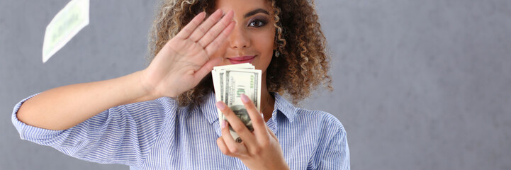 Beautiful black woman portrait. Scattering money notes