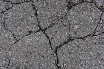 Obraz premium old broken cracked asphalt texture background