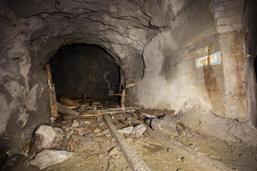 Underground old abandoned iron mine tunnel