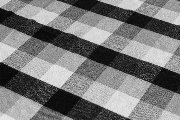 Black and white checkered plaid fabric texture for background. tartan texture
