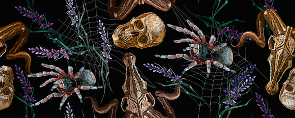 Gothic embroidery. Human skulls, lavender flowers, tarantula spider and bull head, clothes background. Horizontal seamless pattern. Halloween dark background. Fashionable template for clothes