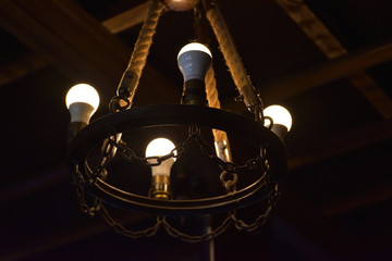 Old style chandelier with rope and chain
