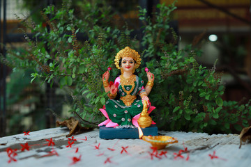 Idol of Mahalakshmi, Diya and Tulsi on the auspicious occasion of Deepawali