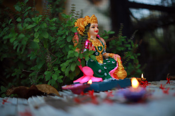 Idol of Mahalakshmi, Diya and Tulsi on the auspicious occasion of Deepawali