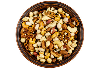 Bowl with mixed nuts isolated on white background. Walnuts, pistachio, almond, peanut, cashew, hazelnut in ceramic bowl. Top view