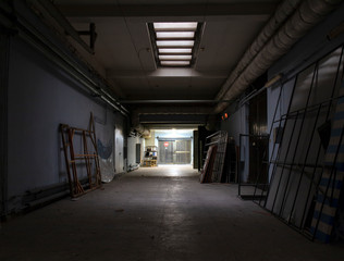 Long dark corridor in an old industrial building