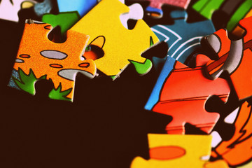 Children's puzzles on a dark background close up. Retro style toned