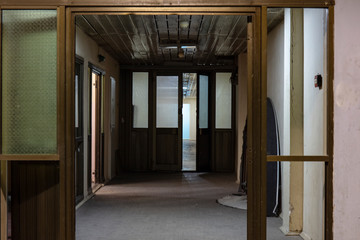 Long dark corridor in an old industrial building