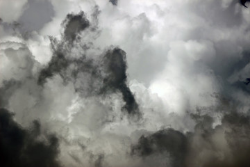 Close up detail of grey storm clouds provides an eerie cloudscape textured background