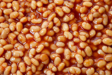 White beans in tomato sauce close-up. Background, textureй