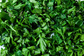 Fototapeta na wymiar Freshly chopped green parsley. Texture, background