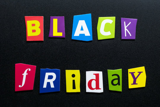 Text - Black Friday - on dark background. Cut colorful letters from newspapers. Shopping, sale concept. Card with an inscription. Headline, caption on banner. 