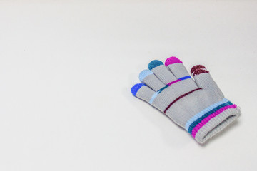 Children's glove, with colorful stripes, isolated on a white background.
