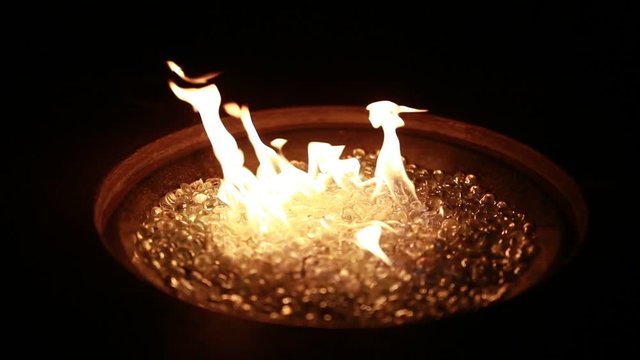 A fire burns at night in 120p super slow motion.