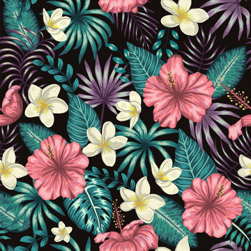 Vector seamless pattern of green tropical leaves with plumeria and hibiscus flowers on black background. Summer or spring repeat tropical backdrop. Exotic jungle ornament.. © Lexi Claus