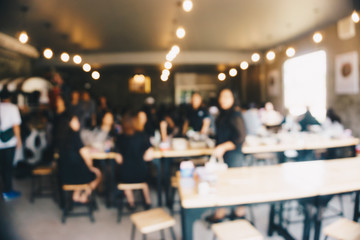 Blurred group of people eating food in restaurant