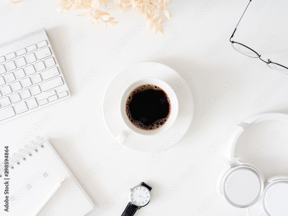 Wall mural top view of office desk table with coffee cup, keyboard and notebook on white background, graphic de