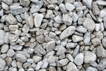 Background made of a closeup of a pile of pebbles.