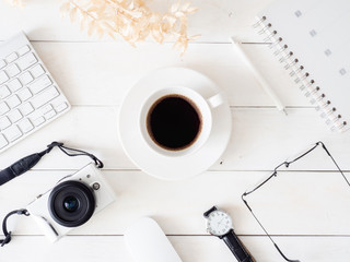 top view of office desk table with coffee cup, keyboard and notebook on white background, graphic designer, Creative Designer concept.