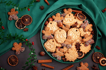 Tasty homemade Christmas cookies in the green plate.