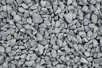 Background made of a closeup of a pile of pebbles.